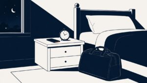 Illustration of a crewmember's bedroom at night with a packed uniform bag and a phone on the nightstand.